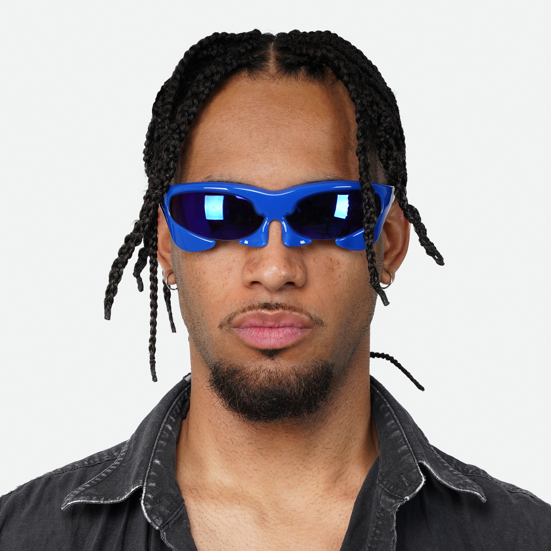 Front view of male model wearing Ruggeri Carapace sunglasses in captivating blue, emphasizing the unique custom-moulded insectoid appearance with Category 3 UV400 REVO lenses.