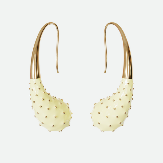 Aspera hand-painted cream enamel earrings with golden accents, designed by Ruggeri, on a white background.